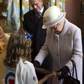 Emma Stewart presenting a picture to the Queen